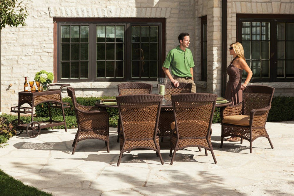 Lloyd Flanders Grand Traverse Wicker Umbrella Dining Table 84" Oval With Lay on Glass