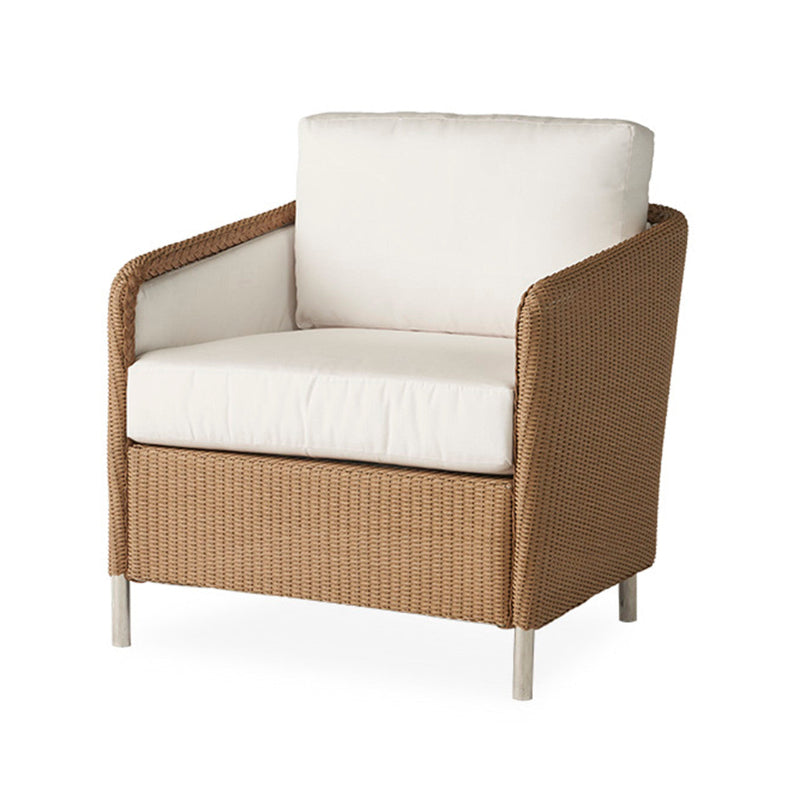 Wicker armchair with white cushions on a white background