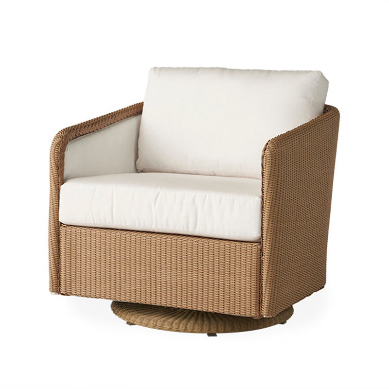 Wicker chair with white cushions on a white background