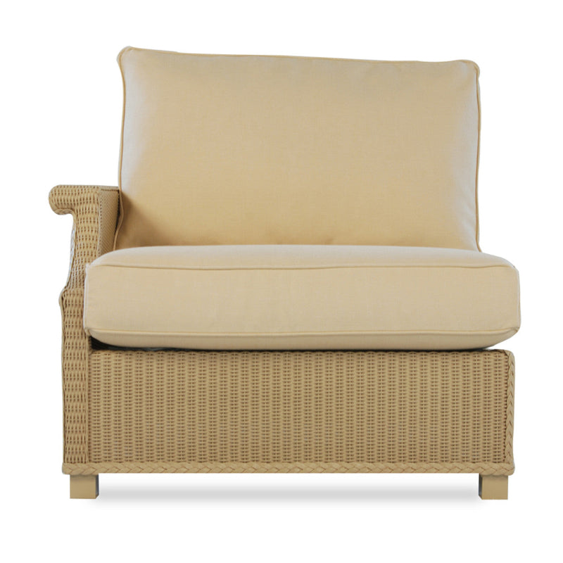 An outdoor wicker chair with a beige cushion and a right arm sectional design.