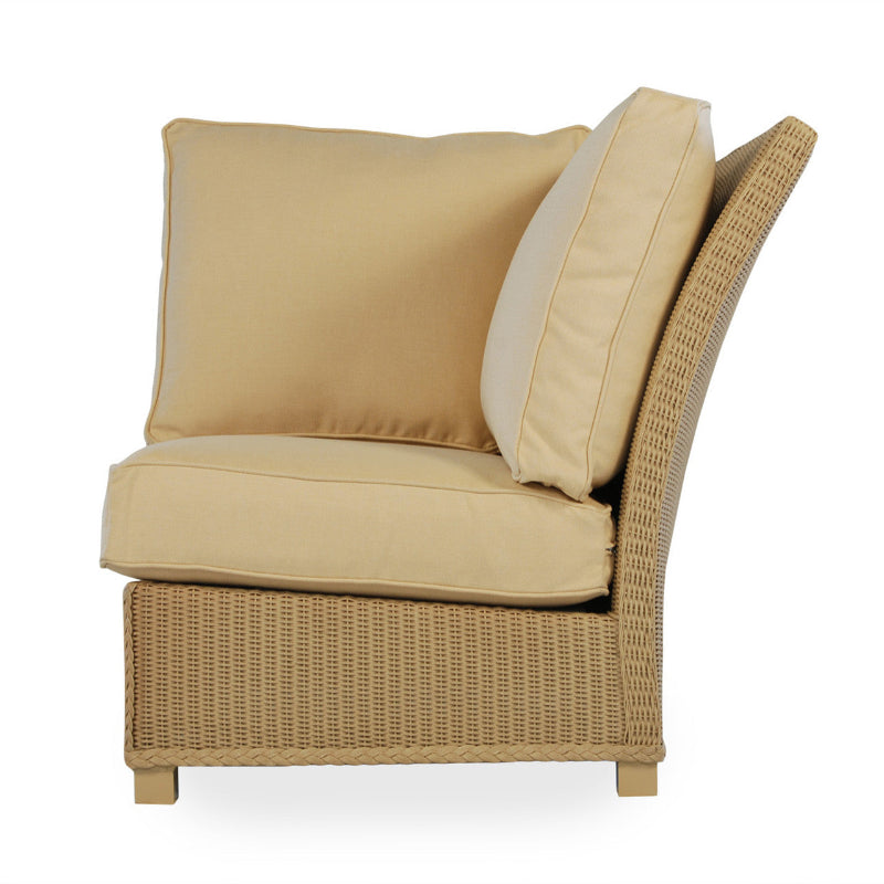 Beige wicker chair with cushions on a white background