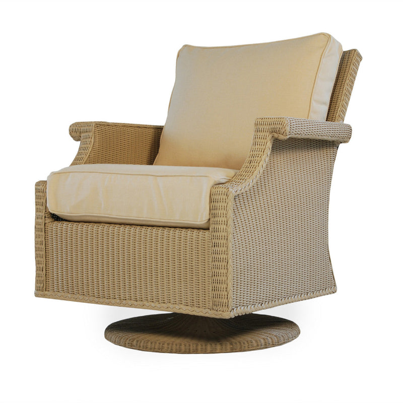 Wicker swivel chair with beige cushions on a white background