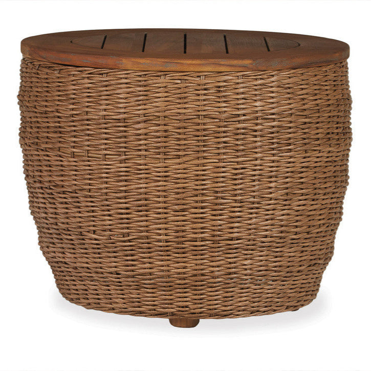 A round, brown wicker end table with a teak top and a slatted design, featuring a natural hyacinth finish.