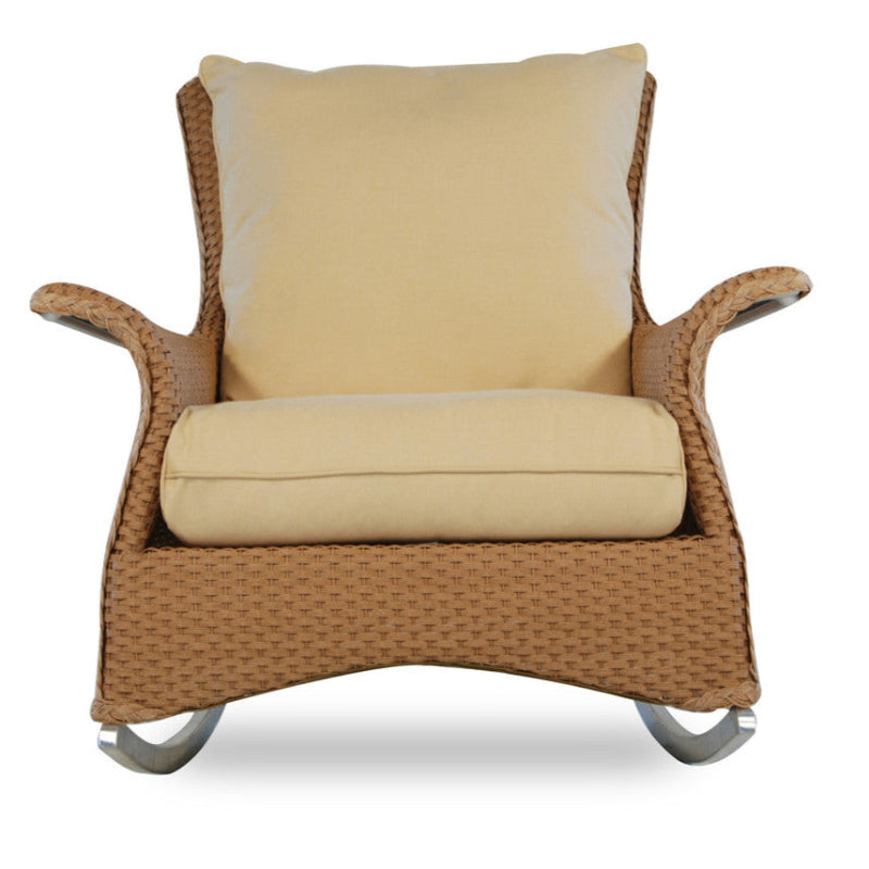 Wicker chair with beige cushions on a white background