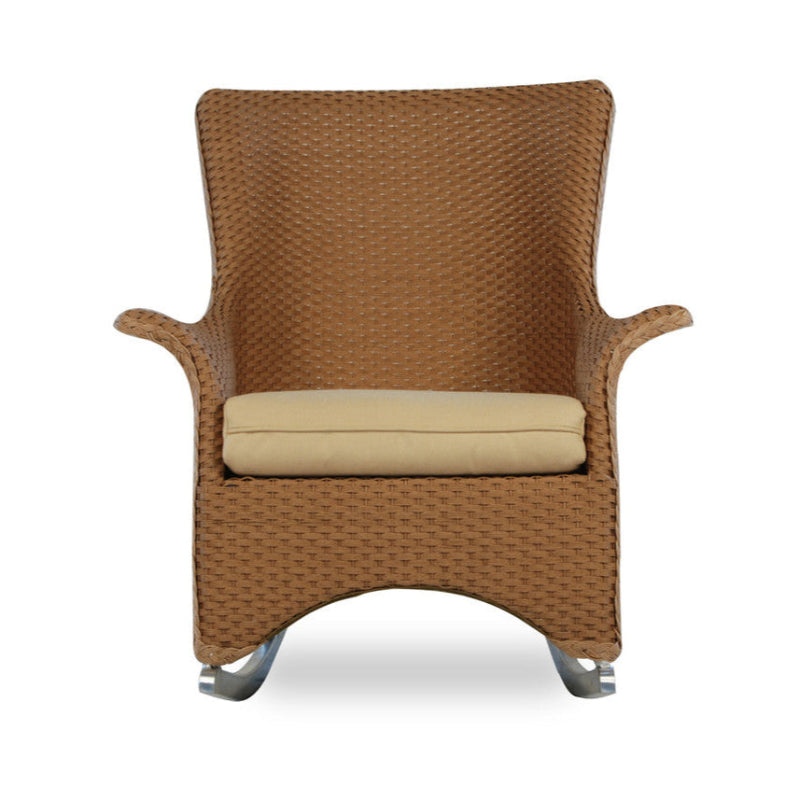 A brown wicker porch rocker with a cloud-patterned cushion seat and backrest, featuring a solid pattern design.