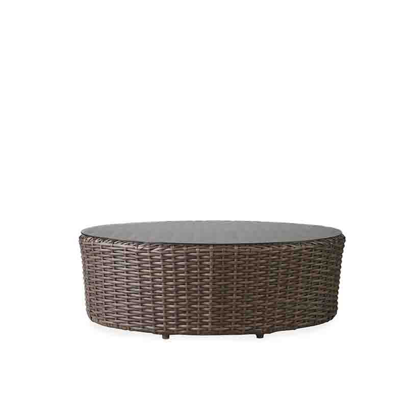 Round wicker coffee table on a white background