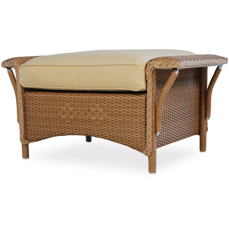 Wicker bench with beige cushion on a white background