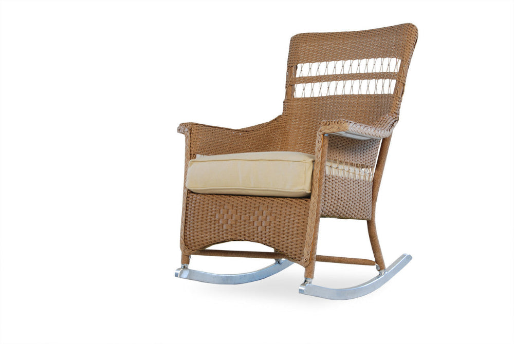 Wicker rocking chair with beige cushion on a white background