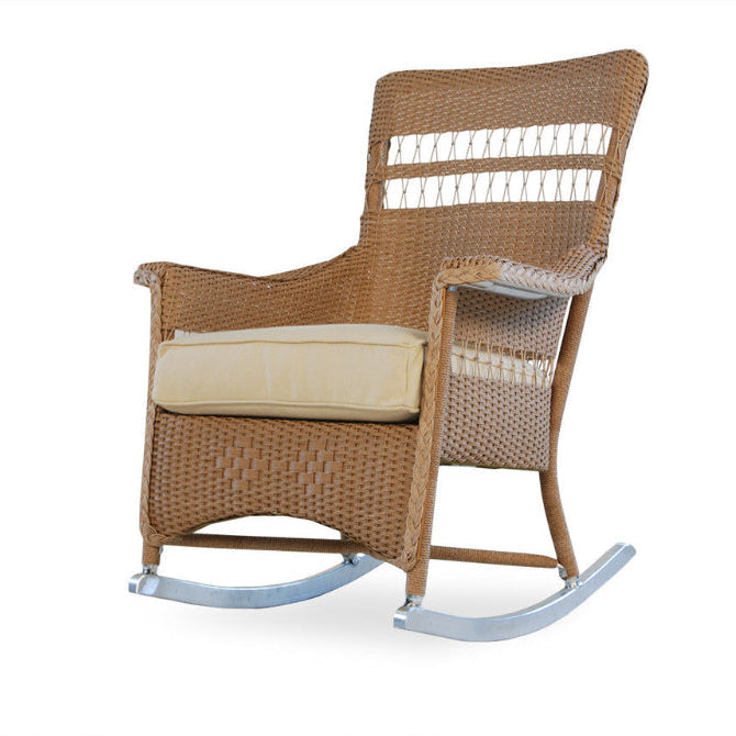 Wicker rocking chair with beige cushion on a white background