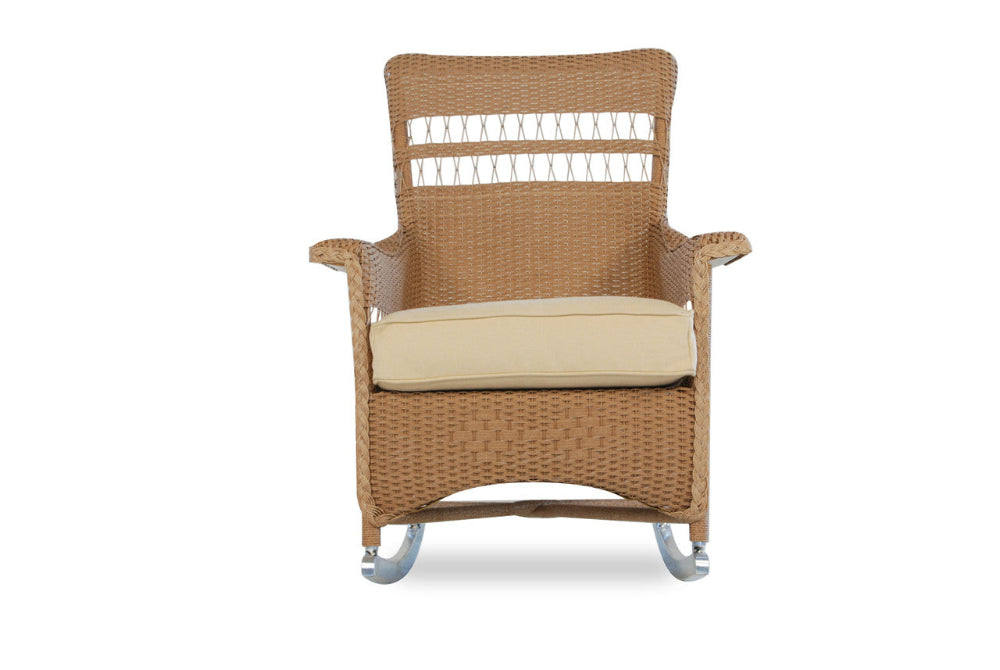 Wicker rocking chair with a beige cushion on a white background