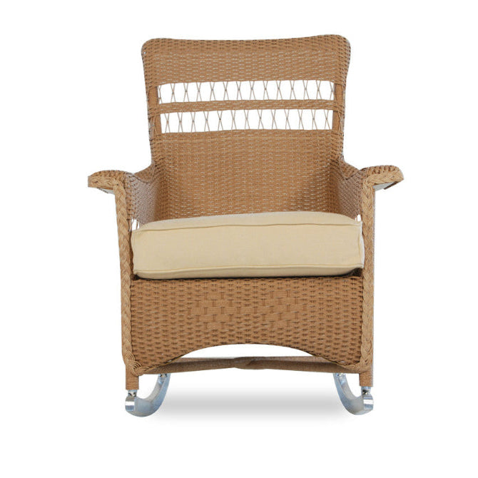 Wicker rocking chair with beige cushion on a white background