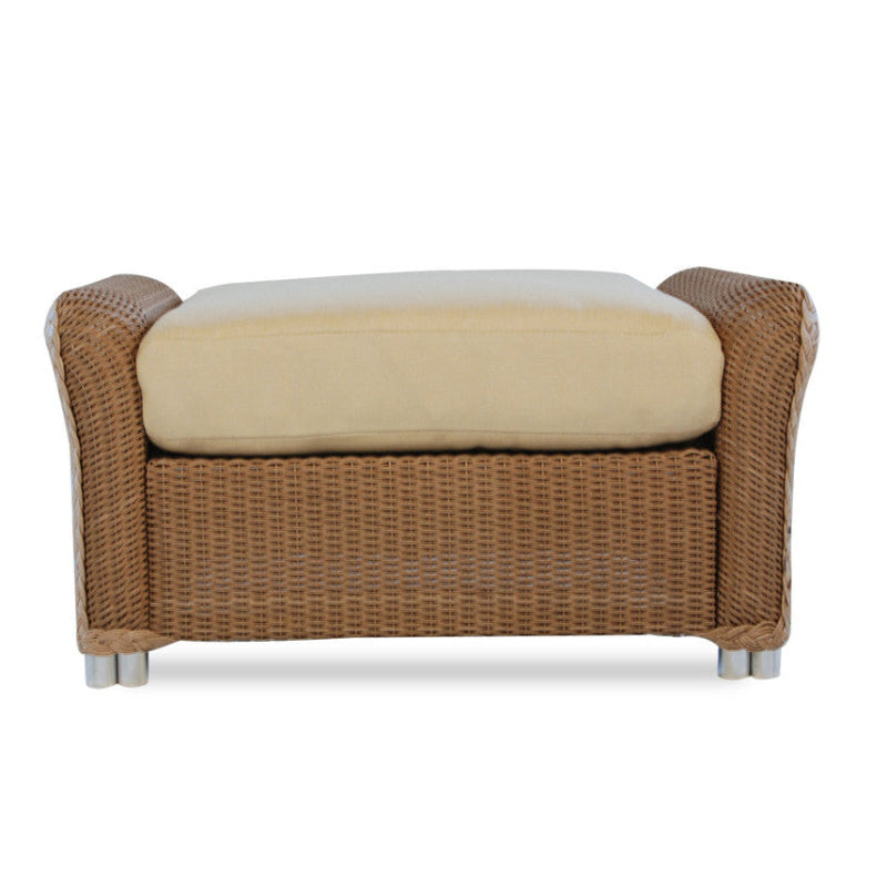 Wicker chair with beige cushion on a white background