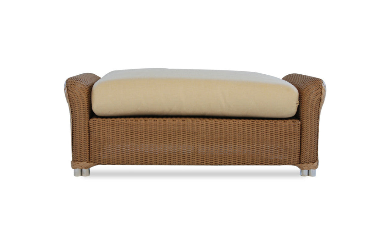 Brown wicker bench with beige cushion on a white background
