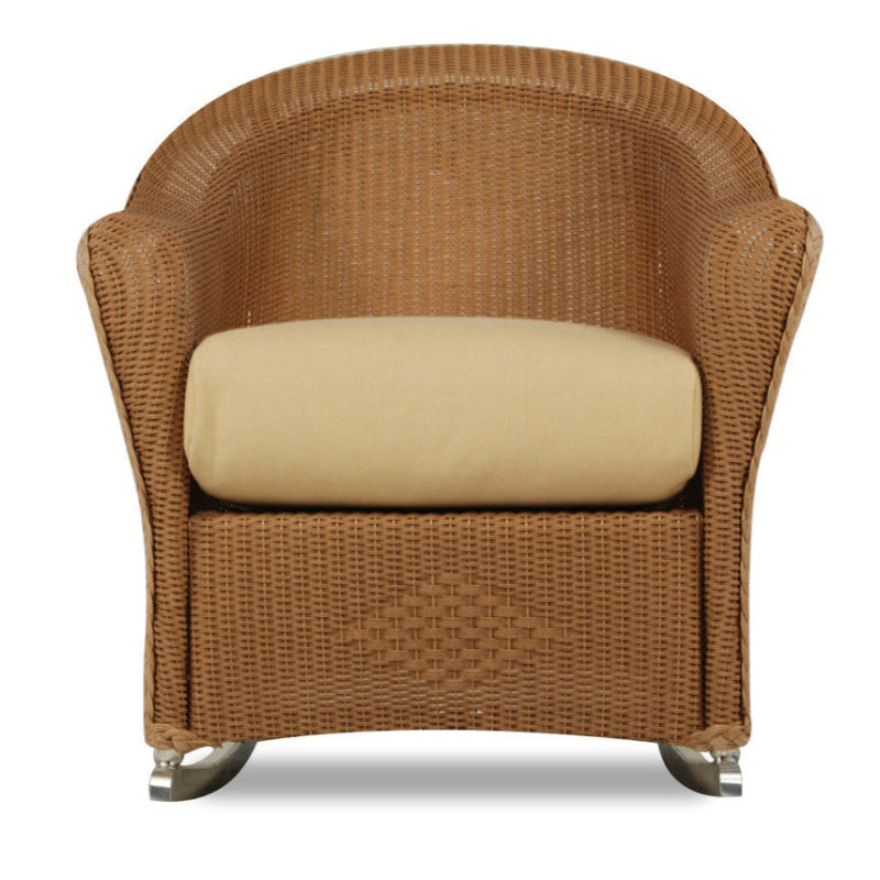 Brown wicker armchair with a beige cushion on a white background