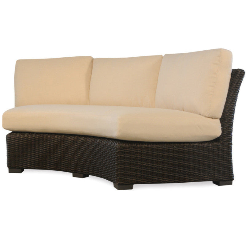 Wicker outdoor loveseat with beige cushions on a white background