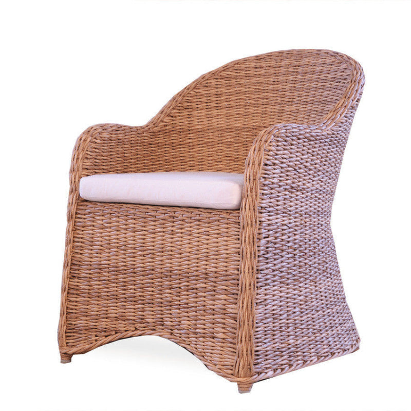 Wicker armchair with a white cushion on a white background