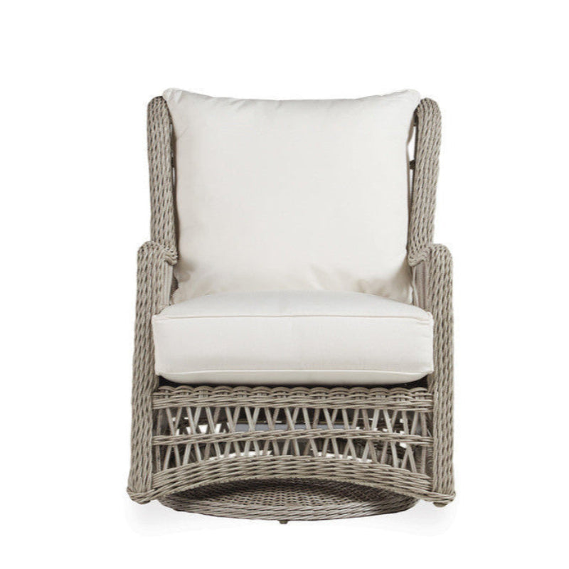 Wicker chair with white cushion on a white background