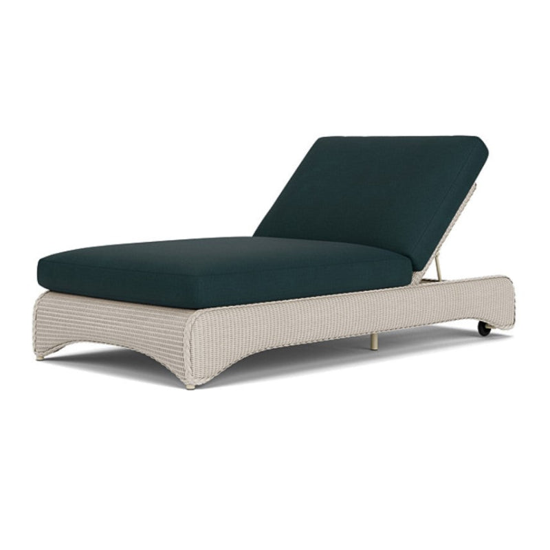 Beige outdoor lounge chair with dark green cushion on a white background