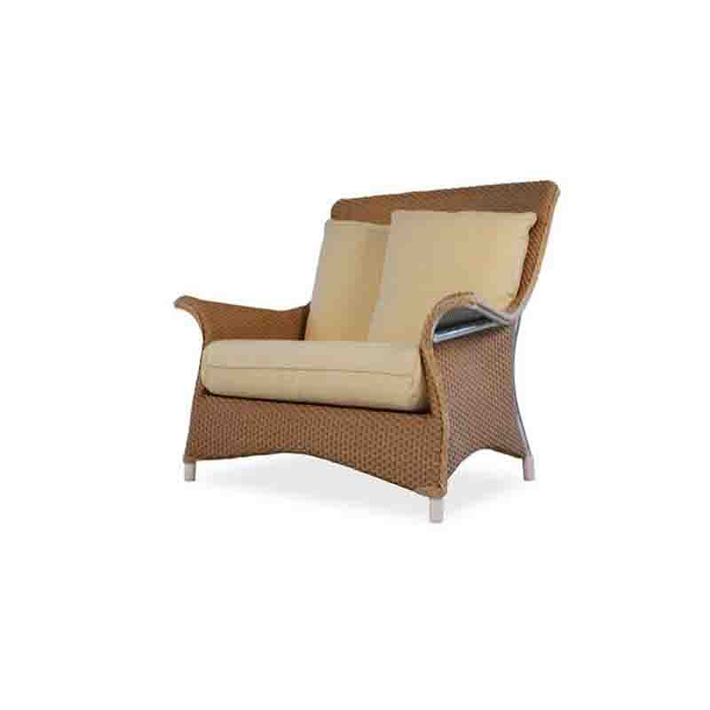 Wicker chair with beige cushions on a white background