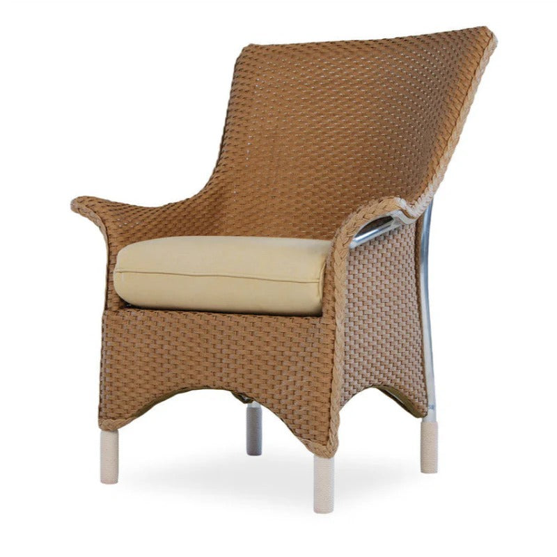 Wicker chair with beige cushion on a white background
