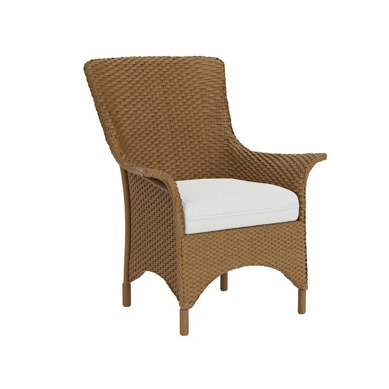 Brown wicker chair with a white cushion on a white background