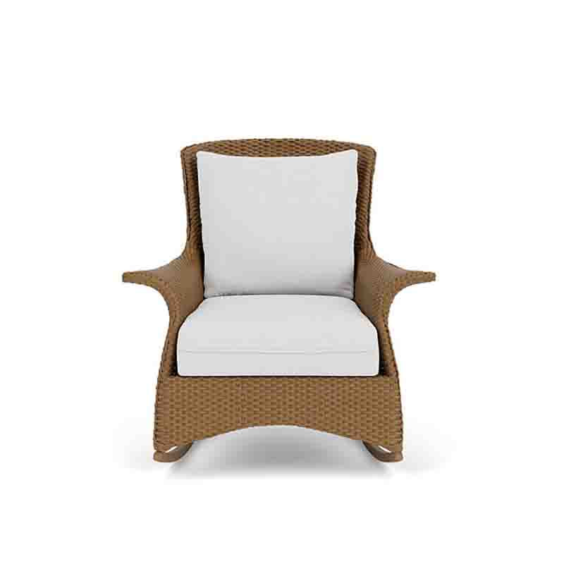 Wicker armchair with white cushions on a white background