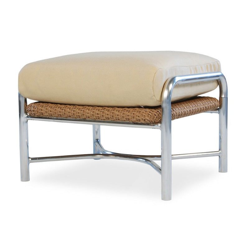 Beige cushioned stool with wicker seat and chrome frame on a white background