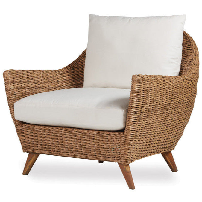Wicker armchair with white cushions on a white background