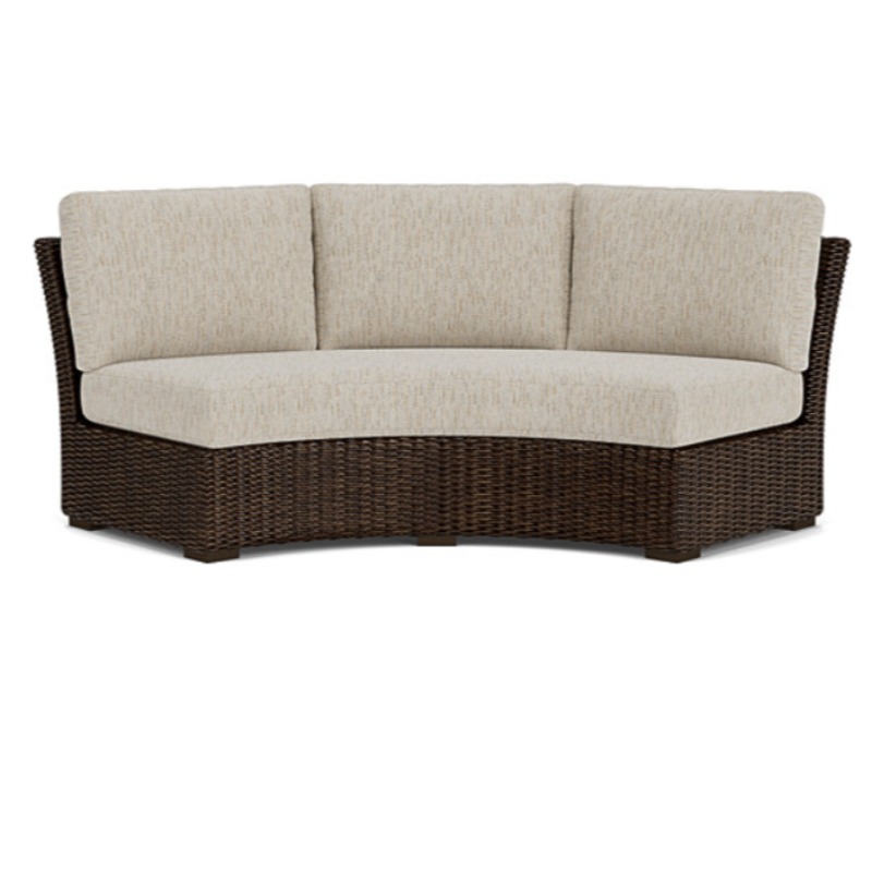 Wicker outdoor sofa with beige cushions on a white background