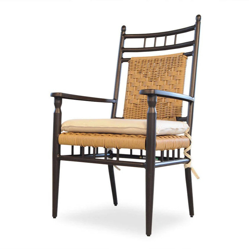 Chair with wicker backrest and cushion on a white background