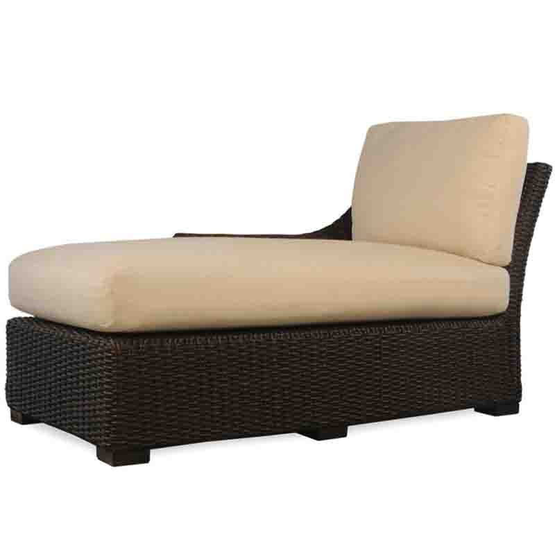 Wicker outdoor lounge chair with beige cushions on a white background