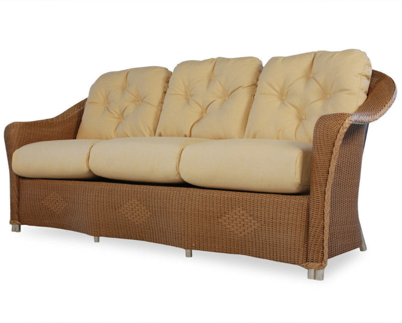 Beige cushioned sofa with wicker frame on a white background