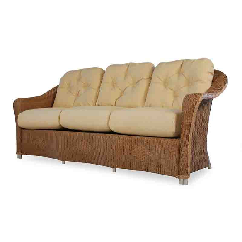 Wicker outdoor sofa with beige cushions on a white background