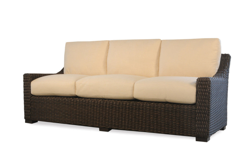 A beige woven vinyl sofa with a dark brown base and cushions, designed for outdoor use.