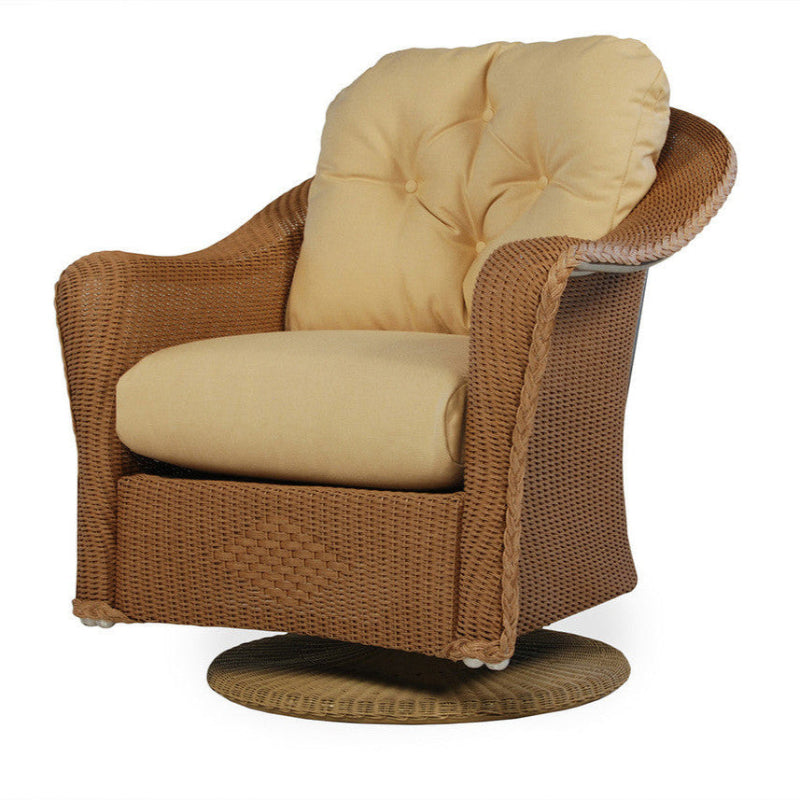 Brown wicker swivel chair with beige cushions on a white background