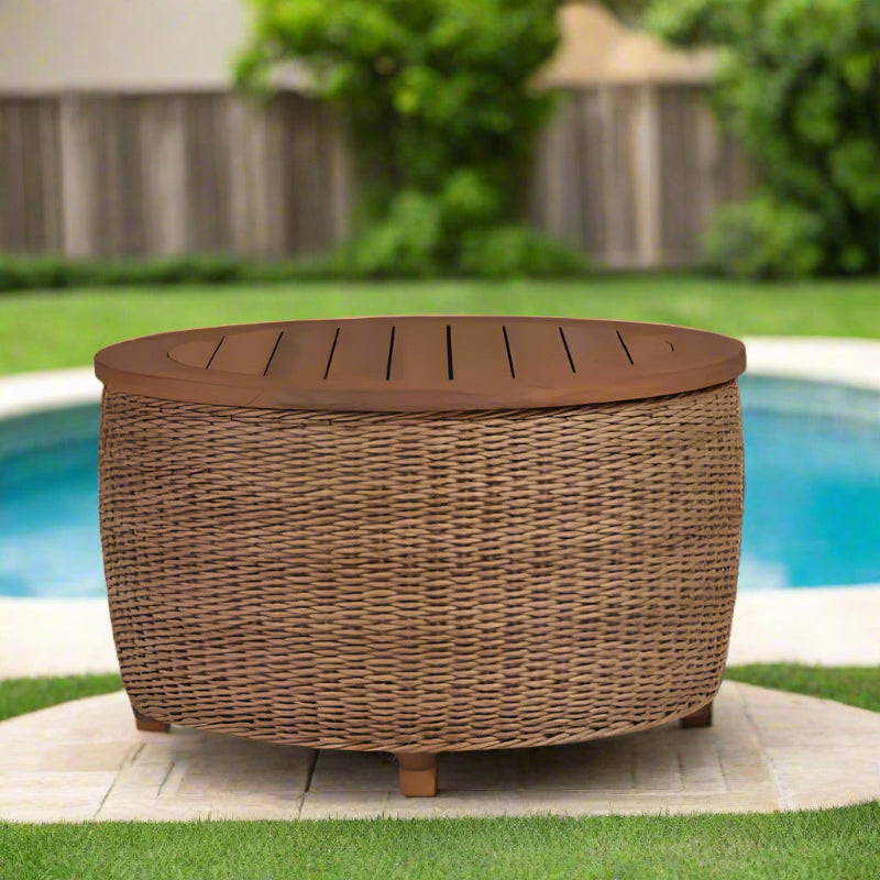 Round wicker storage ottoman with wooden top on a neutral background