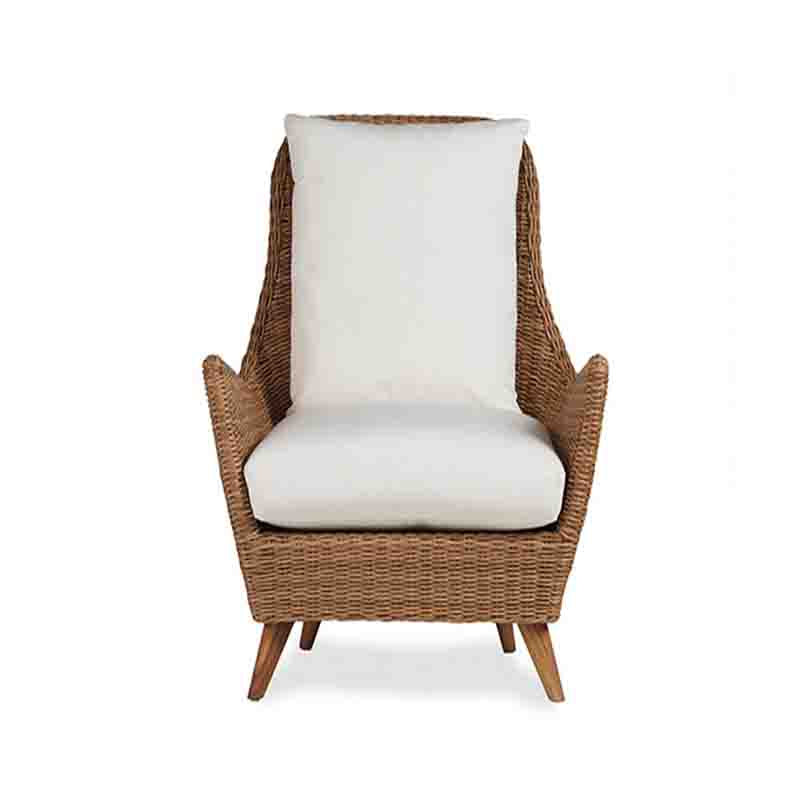 Wicker armchair with white cushion on a white background