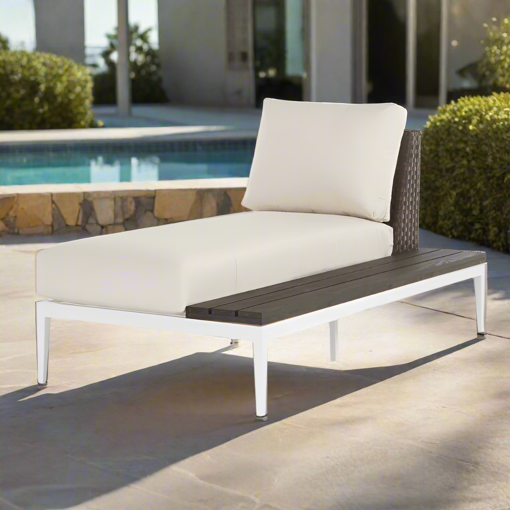 Modern outdoor lounge chair with white cushion and wooden seat on a white background