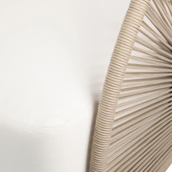 Close-up detail of a modern chair featuring a white upholstered seat and back with a curved, radiating beige rope or cord backrest.