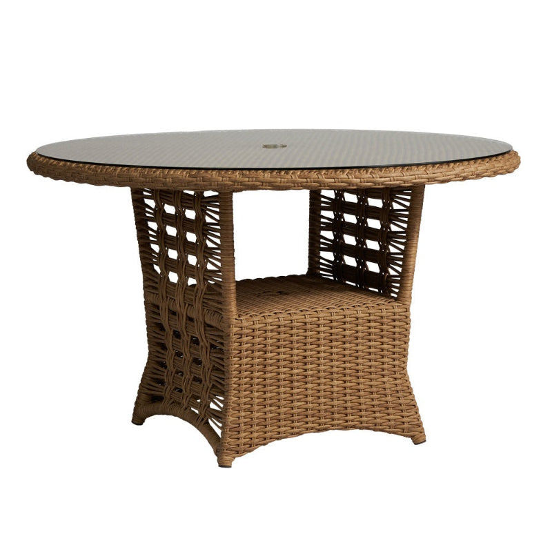 Wicker outdoor table with a glass top on a white background