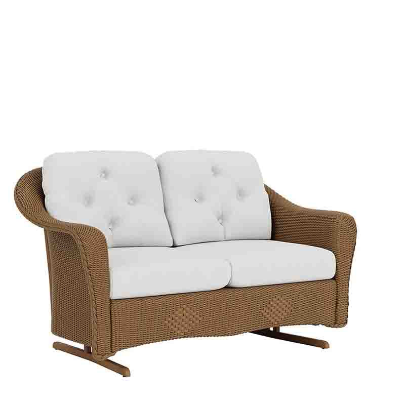 Wicker loveseat with white cushions on a white background