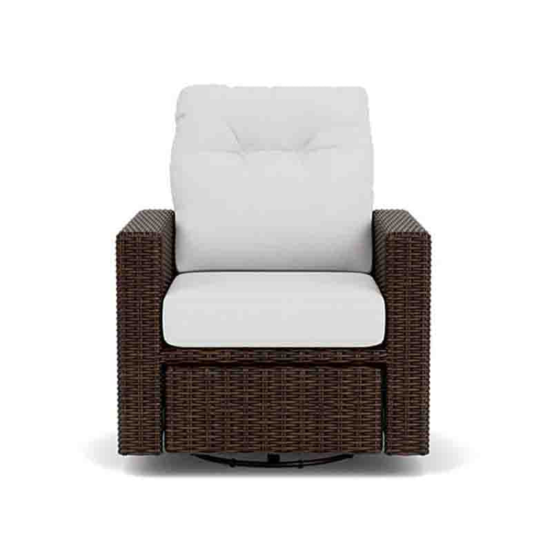 Wicker chair with white cushions on a white background