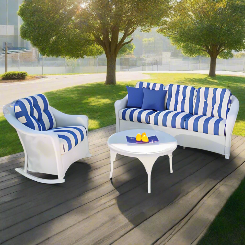 Outdoor furniture set with blue and white striped cushions on a wooden deck.