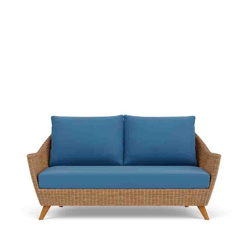 Sofa with blue cushions and wicker frame on a white background