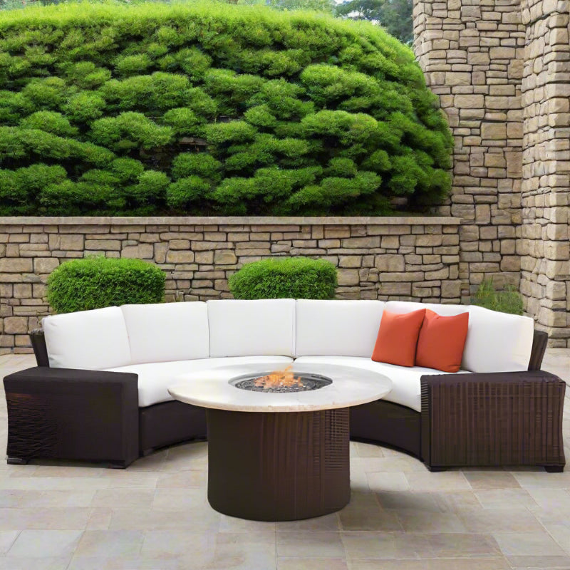 Outdoor patio set with sectional sofa and fire pit table on a patio.