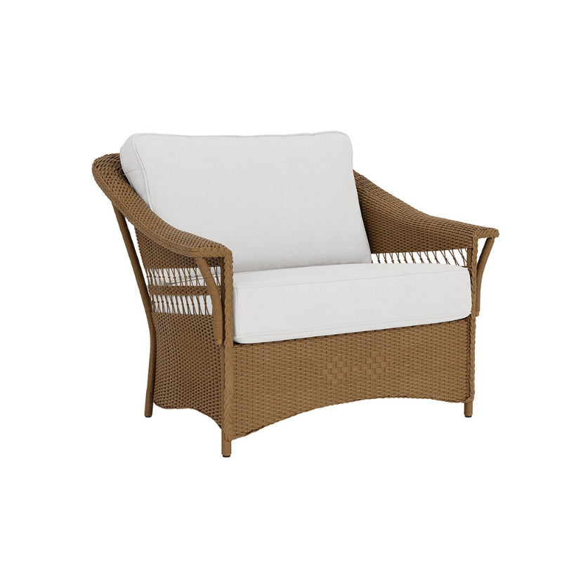 Brown wicker chair with white cushions on a white background