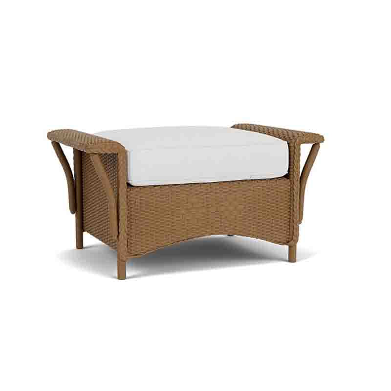 Wicker chair with a white cushion on a white background