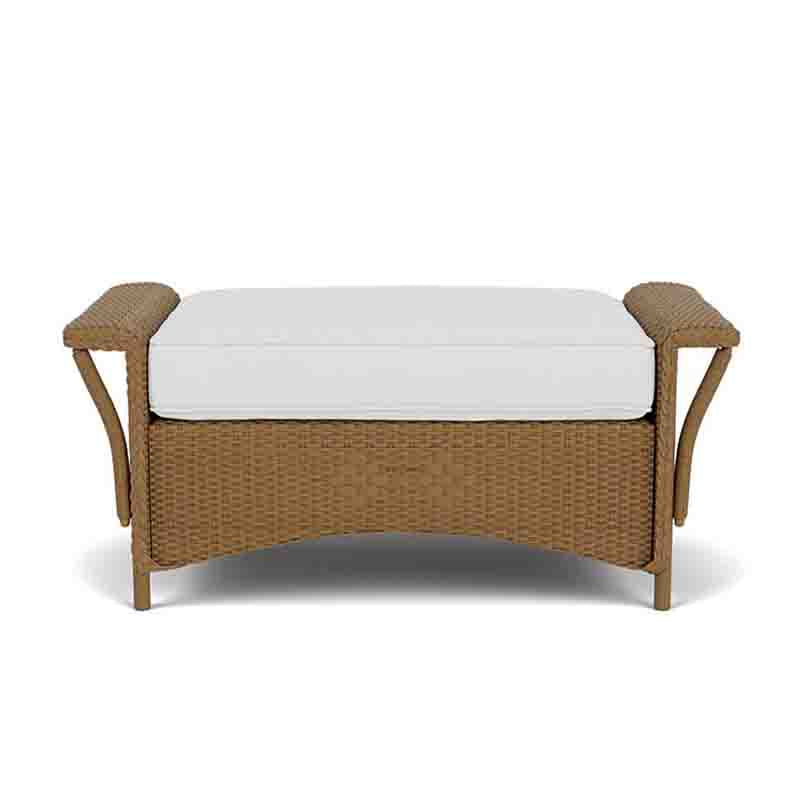 Wicker bench with white cushion on a white background