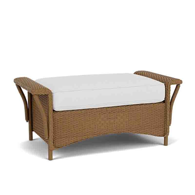 Wicker bench with white cushion on a white background