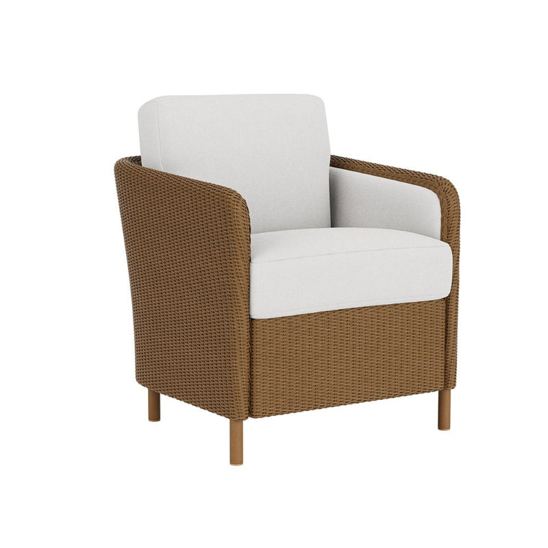 Brown wicker armchair with white cushions on a white background
